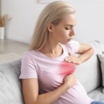 Young slim woman enjoys weight loss result